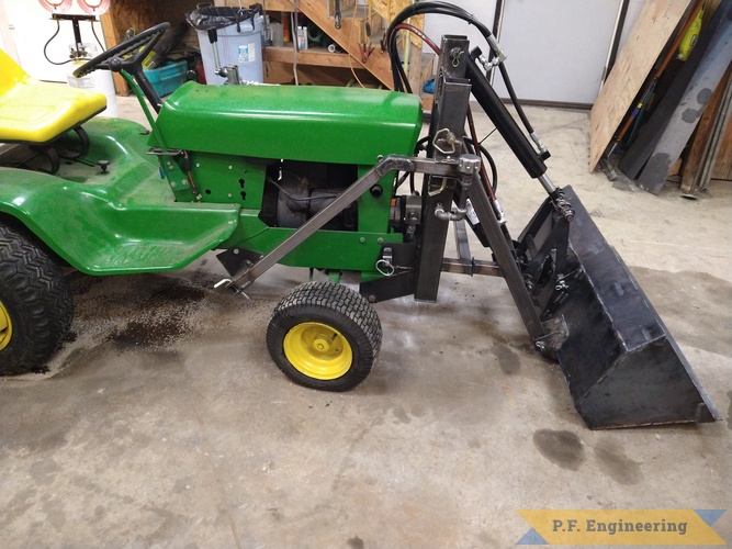 Richard W. from Winchester, ID and his John Deere 140 Pin On loader | Richard W. built this Pin On Loader for his John Deere 140 right side view