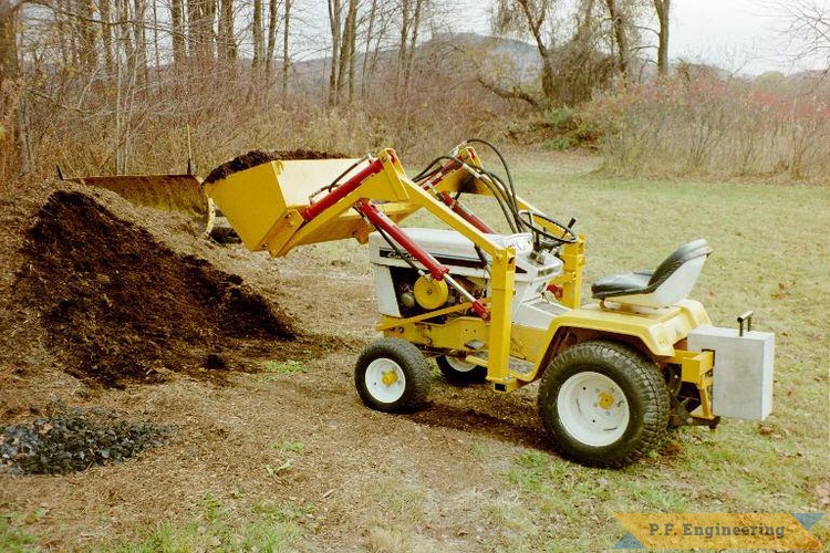 Paul F. of Amherst, MA (hey that's me!) built this loader for his cub cadet 149 garden tractor in 1998 and soon after began selling plans to the public as p.f.engineering | Cub Cadet 149 Garden Tractor Loader_2