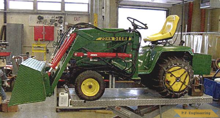 the loader for this John Deere 318 garden tractor was built by a vocational school class at Montachusett technical vocational school in Fitchburg, MA (www.montytech.net). the tractor was owned by their teacher and the class project was a great way to learn  about hydraulics. great work! | John Deere 318 garden tractor loader_1
