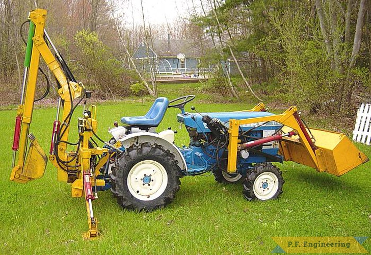 the boom has been modified for an extend-a-hoe option that provides 7.5 feet digging. see my video on this site for action footage. | Ford 1110 compact tractor Micro Hoe_1