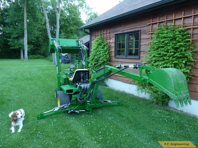 John Deere 318 Micro Hoe Loader with the project supervisor by Walter K., Pointe Claire, Quebec, CN