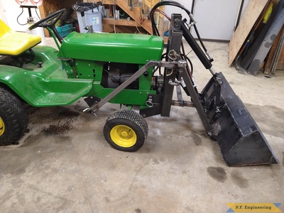 Richard W. from Winchester ID and his JD 140 with pin on mini payloader right side
