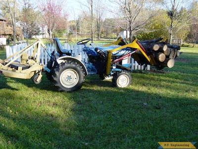 ford 1110 carrying logs with 48 inch finish mower as counterweight